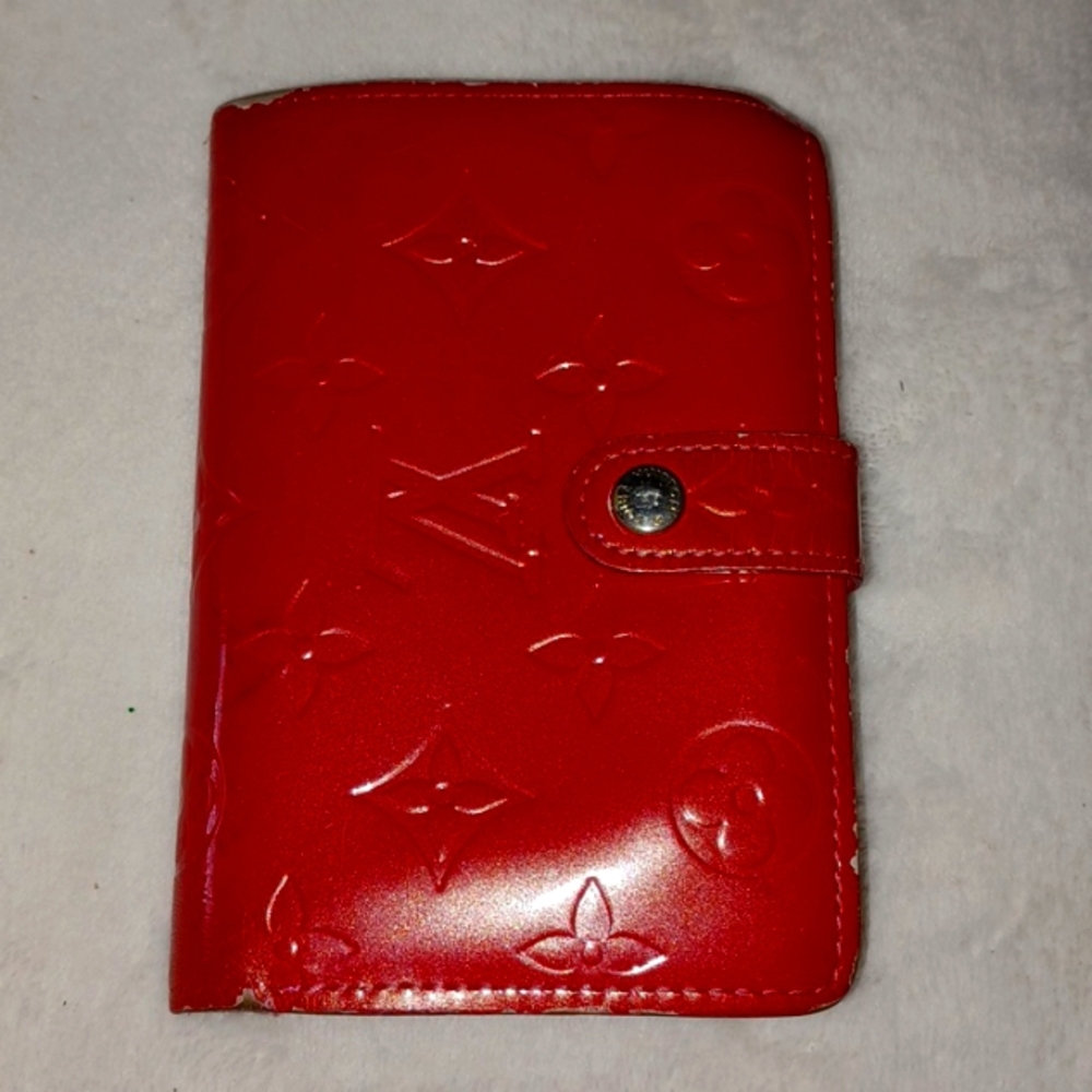 Louis Vuitton Red Wallet with Glossy Finish and Embossed Design